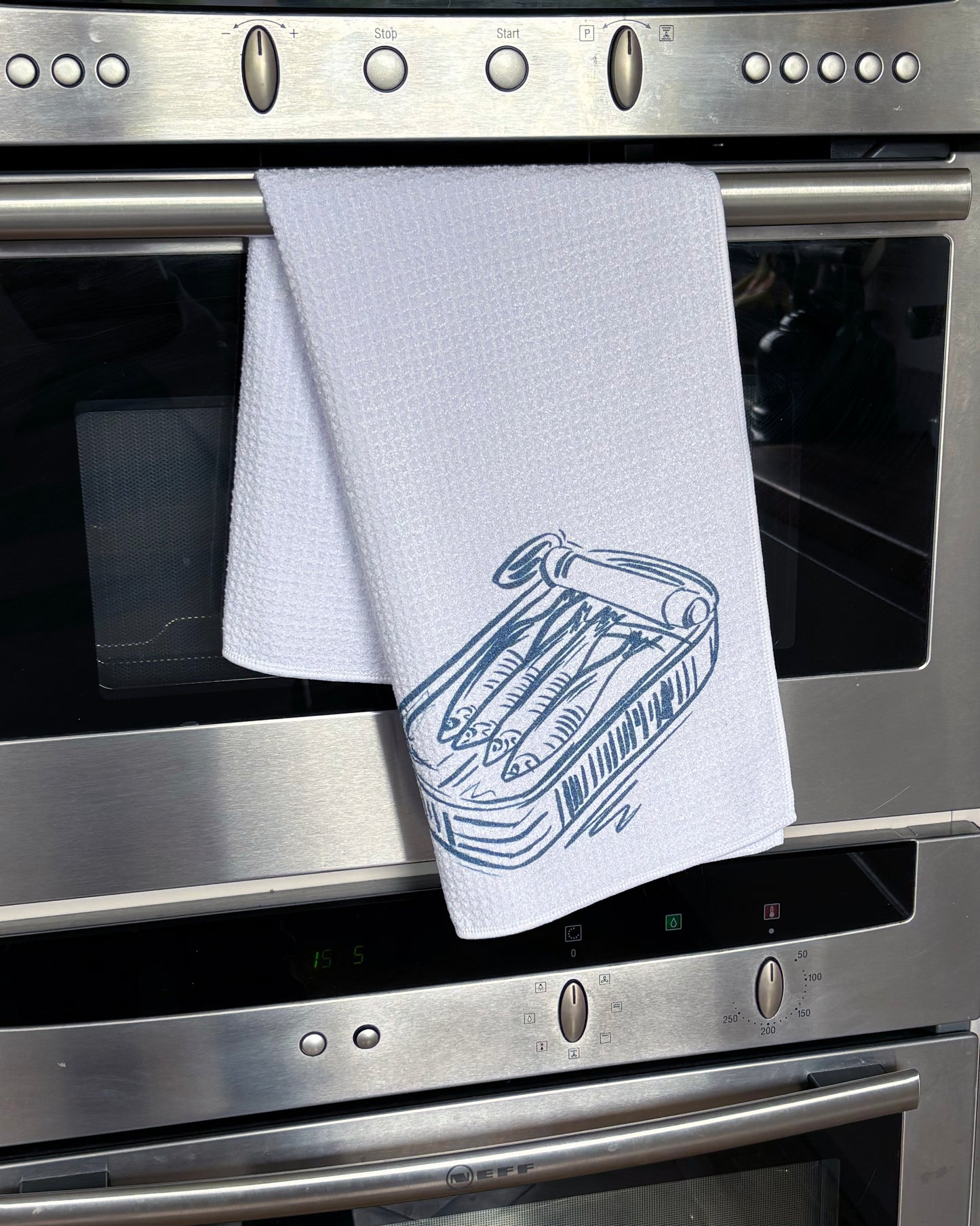 Sardine tin, waffle tea towel